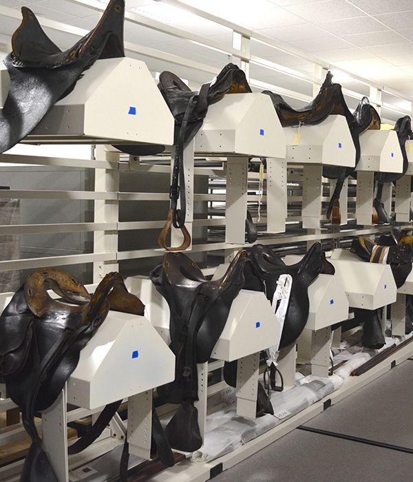 Saddle stirrups collection stored on custom Spacesaver solution