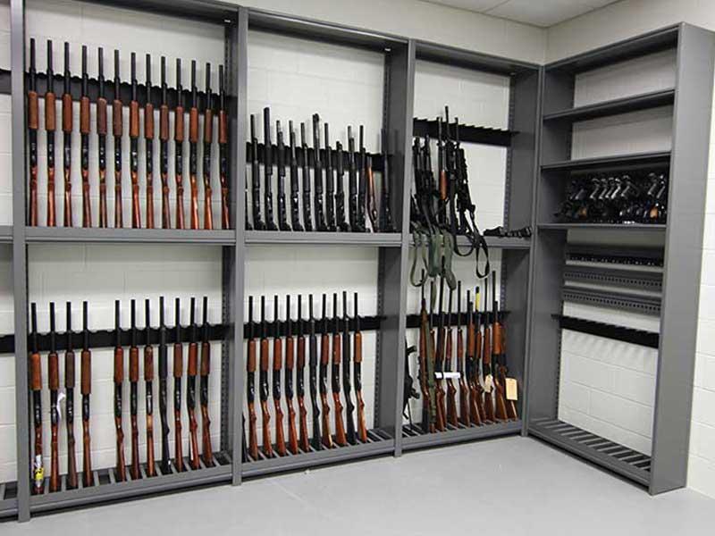 weapons shelving holding various long guns